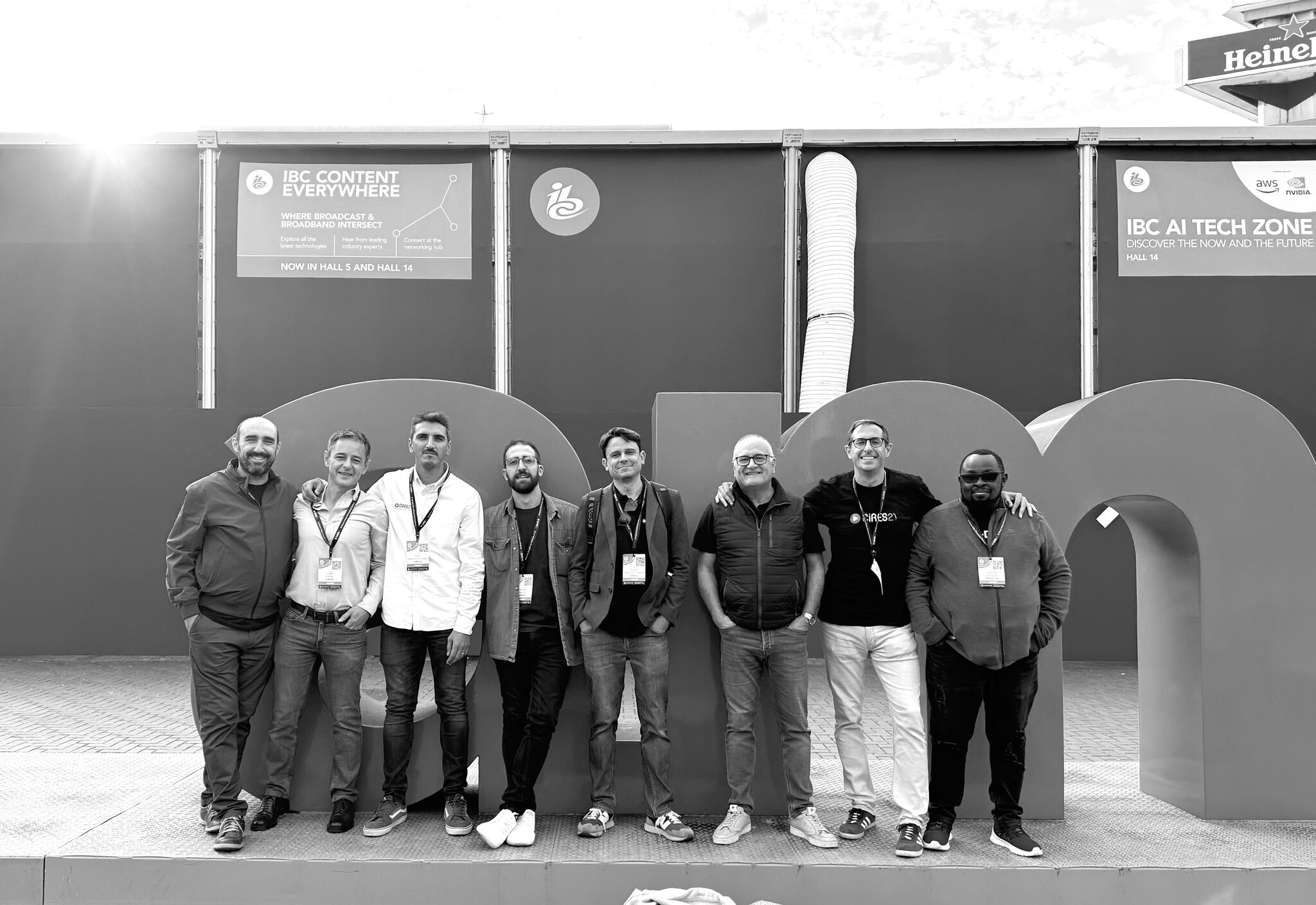 A black and white picture of some of the Cires21 team posing for a pic at IBC 2024 in Amsterdam